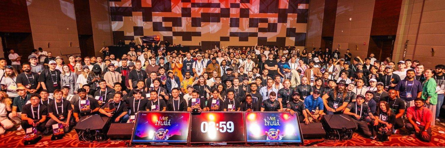 Meteora's banner on X, a group photo of its community at an event